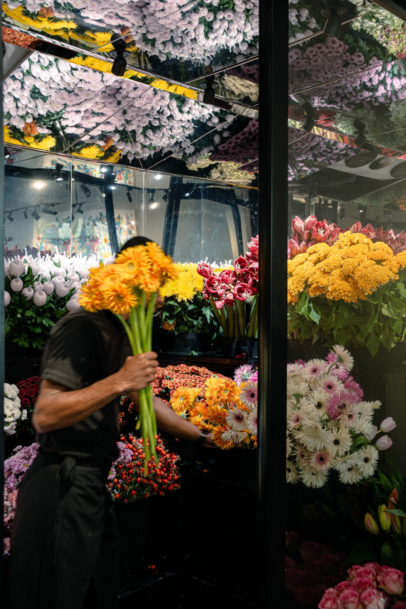 Florist carrying orange gerberas